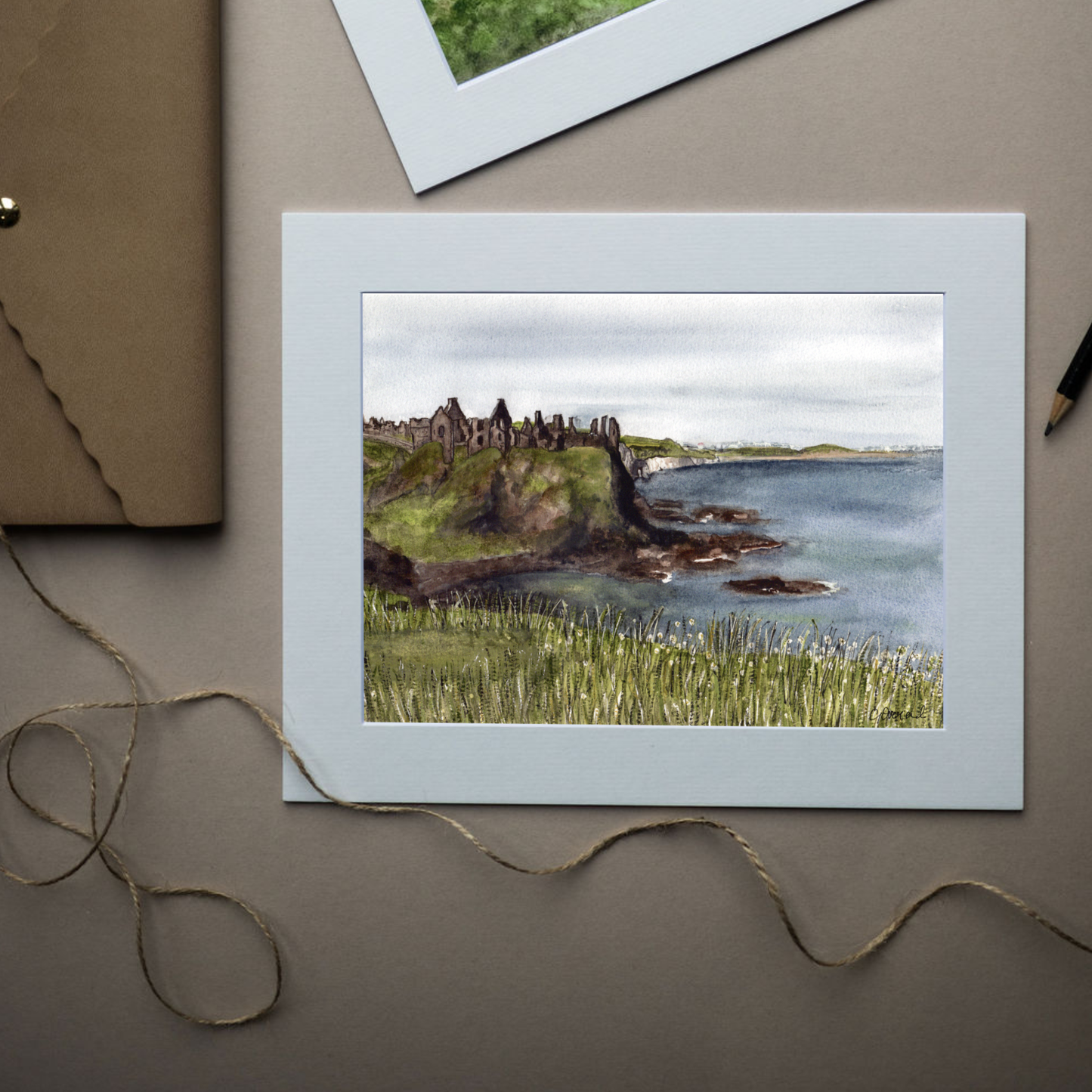 Mounted Dunluce Castle, County Antrim archival art print in an antique white mount.